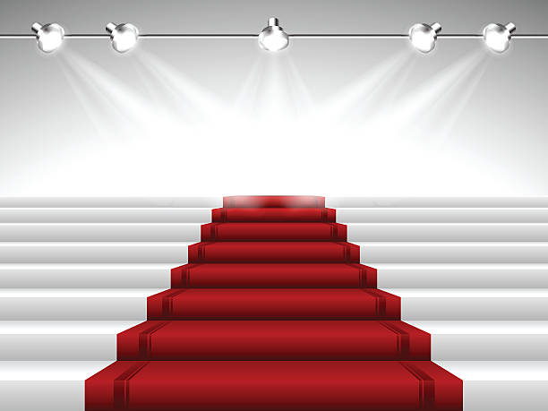 Red Carpet under Spotlights Vector illustration representing perspective  illuminated red carpet with stairs leading to stage under spotlights. File includes high rsolution JPEG. hollywood stock illustrations