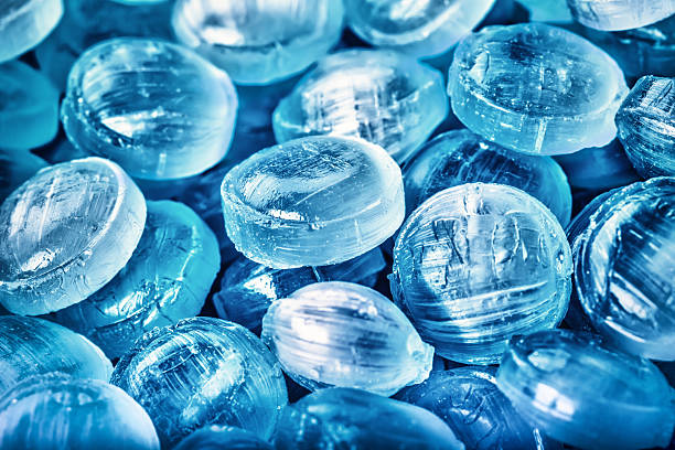 Blue abstract background or texture of sweets and menthol candies.Macro concept
