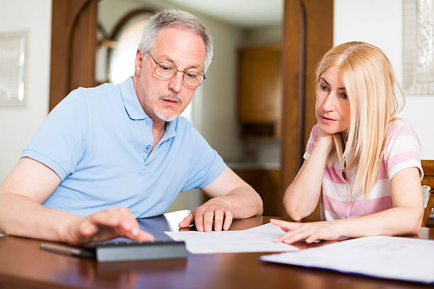 istock Couple calculating their expenses 517847064