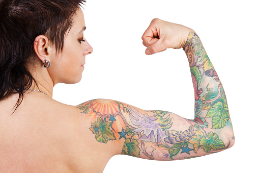 Dark-haired woman with a tattoo showing biceps