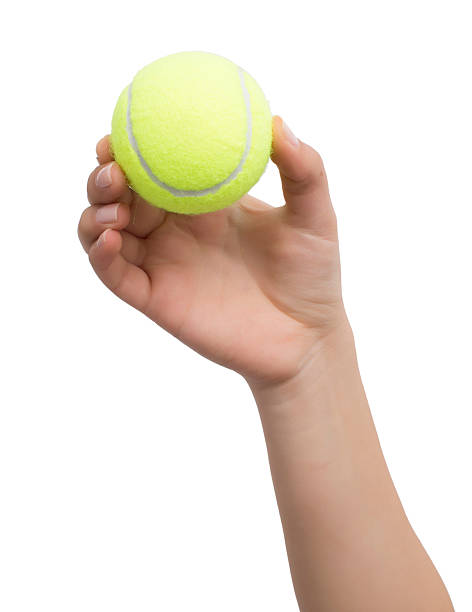 istock hand with tennis ball 517847786