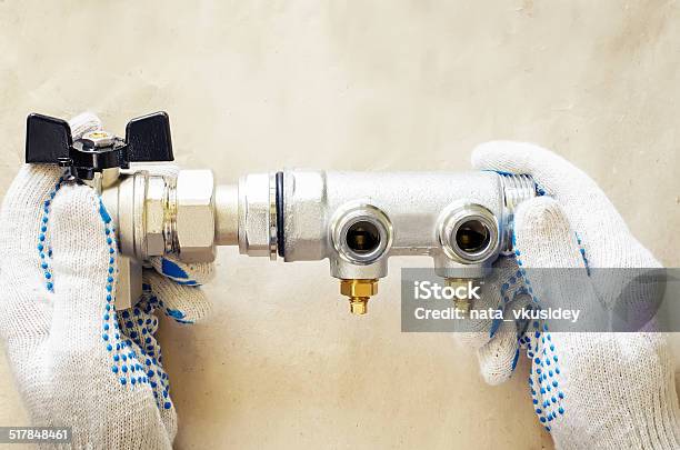 Plumber At Work With Tools Plumbing Stock Photo - Download Image Now - Adjustable Wrench, Backgrounds, Clamp