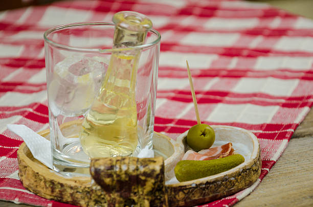 Rakija cucumber olives and bacon on the table in a cafe