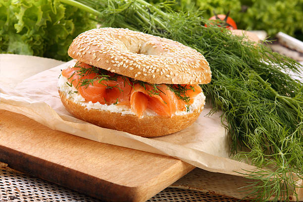 istock Sandwich with smoked salmon and dill on a chopping board 517849411