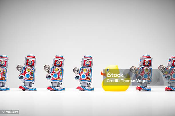 Standing Out From The Crowd Tin Robot Rubber Duck Stock Photo - Download Image Now