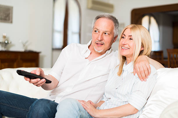 istock Mature couple watching tv 517849982