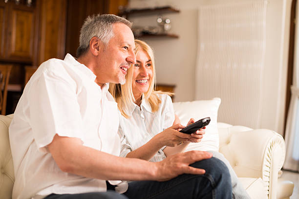 istock Mature couple watching tv 517850146