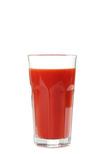 istock Fresh red tomatoes and tomato juice in glass 517850440