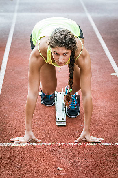 istock Close up view of a female sprinter ready to go 517850571