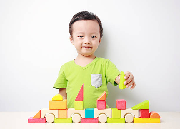 istock Cute asian Children playing with blocks 517850575