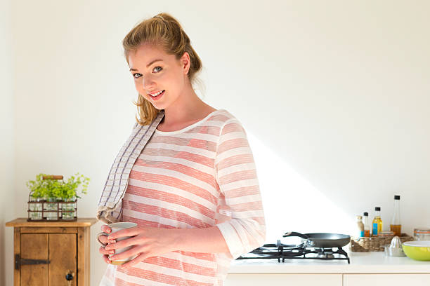 istock Young Woman Drying Dishes 517850619