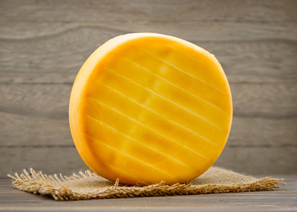 Parmesan cheese wheel on white background