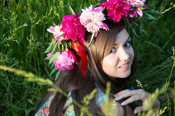istock Girl with floral wreath on her head 517853177
