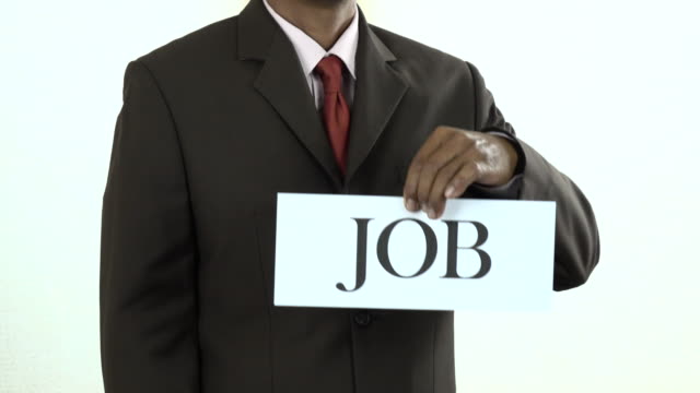 Businessman holding white card with Job sign