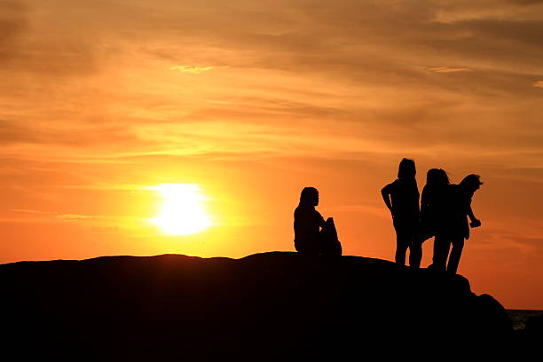 istock Silhouette people the evening sunset. 517854283