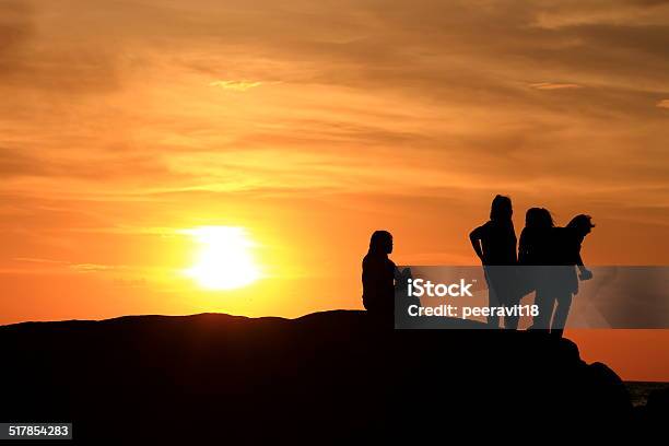 Silhouette People The Evening Sunset Stock Photo - Download Image Now - A Helping Hand, Achievement, Adult