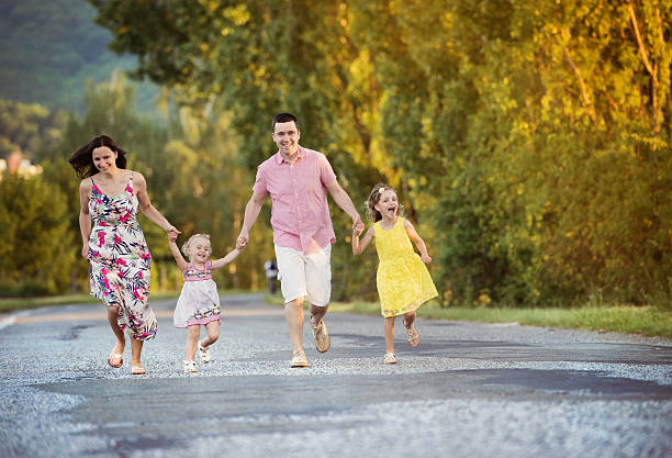 istock Happy family walking on road 517854453