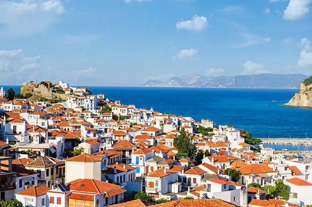 Beautiful Skopelos town in afternoon light. Alonissos island can be viewed at the distance