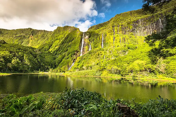 Photo of Azores landscape with waterfalls and cliffs in Flores island.
