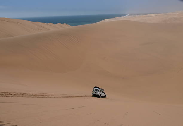 istock 4 wheel drive in the Namib desert 517866534