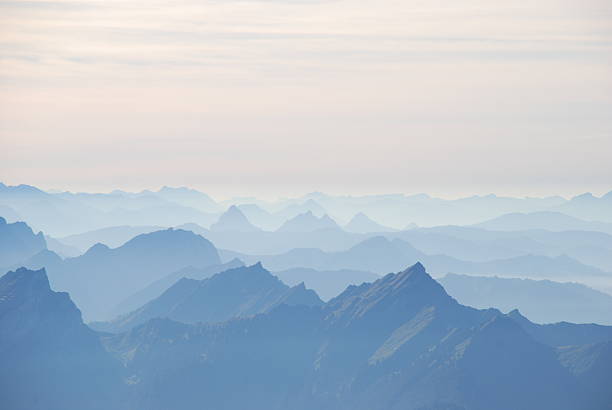 istock Mountain range in haze Swiss alps 517866828
