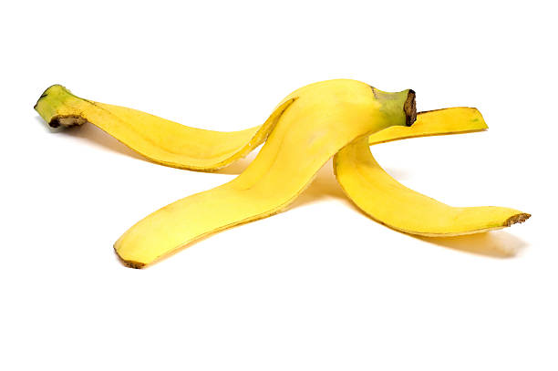 istock Banana peel on white background 517868098