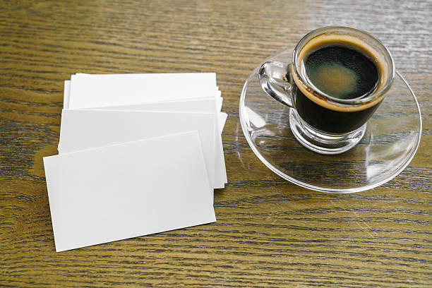 istock Business cards on wood table with coffee 517868766
