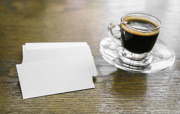 istock Business cards on wood table with coffee 517869024