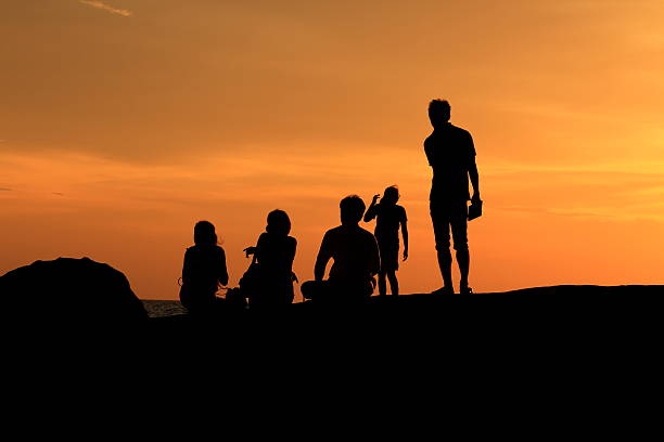 istock Silhouette people the evening sunset. 517869925