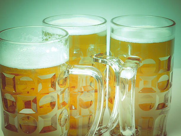 Retro look Lager beer Vintage looking Many large glasses of German lager beer large german beer steins stock pictures, royalty-free photos & images