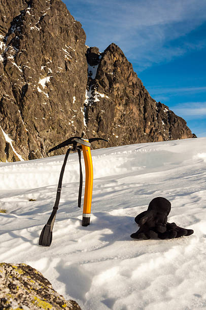 Ice axe and Gloves in the Snow