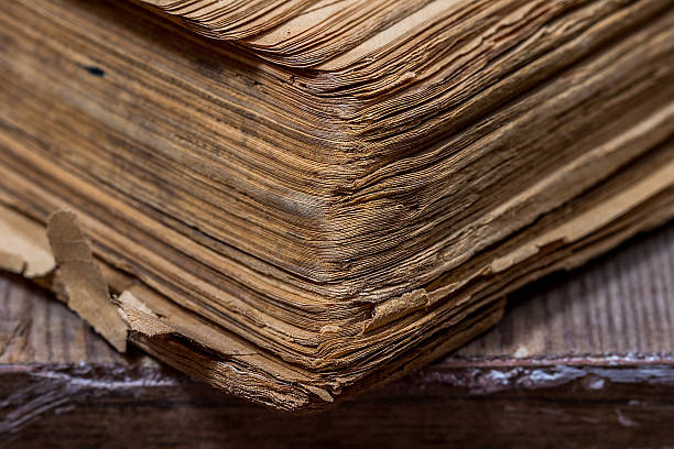 istock Old books in a grunge style on a wooden table 517870966