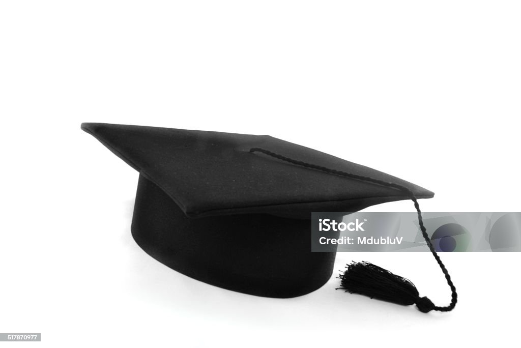 One graduation hat isolated in white A grad hat represent a high achieving student. Graduation Gown Stock Photo