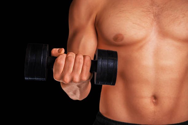 istock Sportsman with dumbbell 517871141