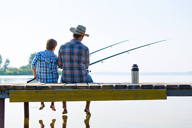 istock boy and his father fishing togethe 517872017