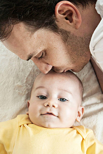 istock Father kissing his baby 517872263
