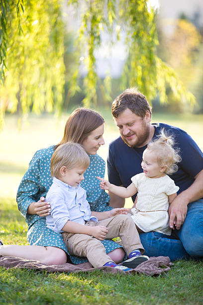 istock Happy family in park 517872334