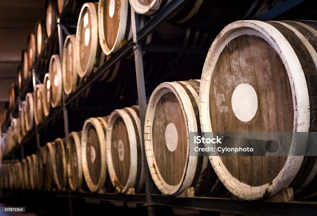 Barrels of plum brandy Part of the technology of producing plum brandy. Distillery Stock Photo
