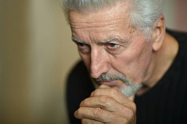 istock Sad senior man at home 517872614