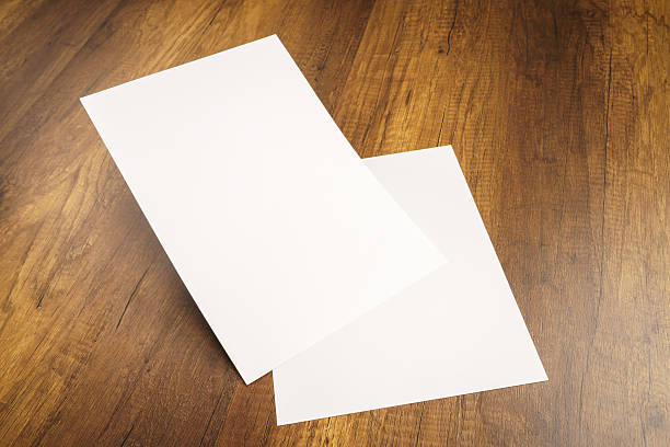 istock White template paper on wood texture 517872718