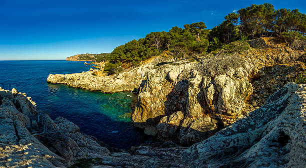 istock Panoramic Cala Deia tropic empty beach turquoise mediterranean Palma Mallorca 517874608
