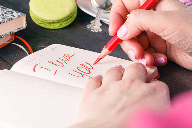 istock Phrase about love written in notebook. Valentines day concept 517874926
