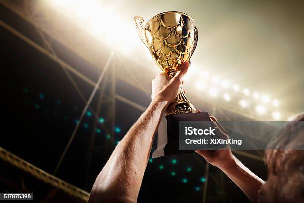 Athlete Holding Trophy Cup Stock Photo - Download Image Now - Soccer, Trophy - Award, Winning