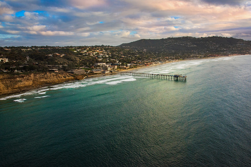 The coastline of La Jolla, a community of the city of San Diego, and Scripps Pier shot near dusk from an elevation of about 400 feet during a chartered photo flight via helicopter.