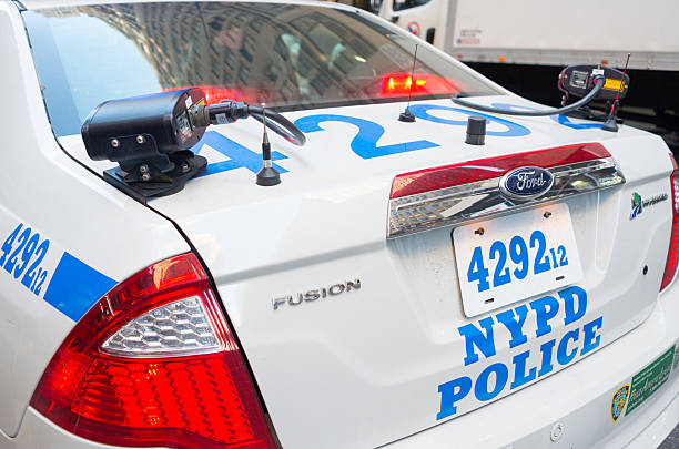 Police license plate reader New York City, USA - December 16, 2015: NYPD Police car with License plate reader (LPR) on the top of the patrol car trunk.  The scanner camera automatically reads license plates of passing cars. Image taken on 29th Street and 6th Avenue, Manhattan. new york state license plate stock pictures, royalty-free photos & images