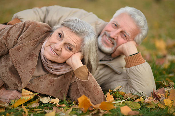 istock Senior couple in autumn park 517877486