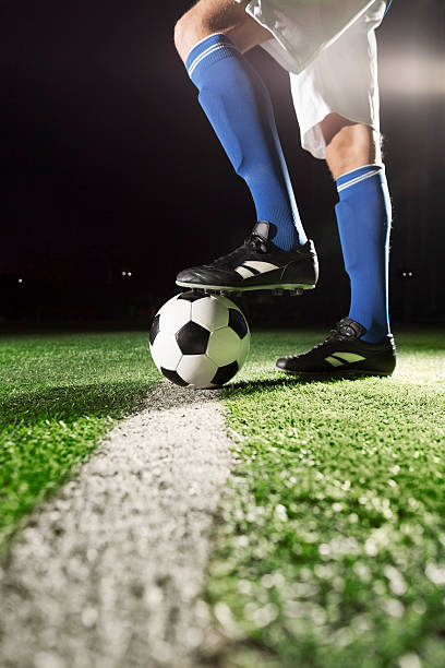 istock Foot on soccer ball 517877806