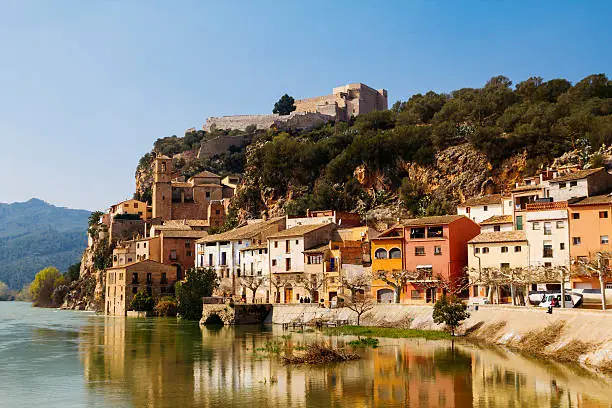 Miravet is an old little village located in the middle of the Terres de lâEbre, in  a beautifull landscape between mountains, the River Ebro and a leafy bank forest, in Catalunya, Spain