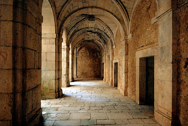 Ruins of an ancient monastery The corridor around the courtyard of a deserted, old monastery near Lerma in Spain monastery stock pictures, royalty-free photos & images