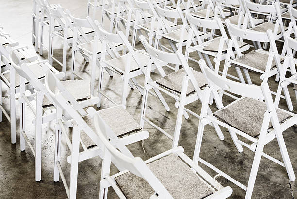 istock group of white wooden empty chair 517892638
